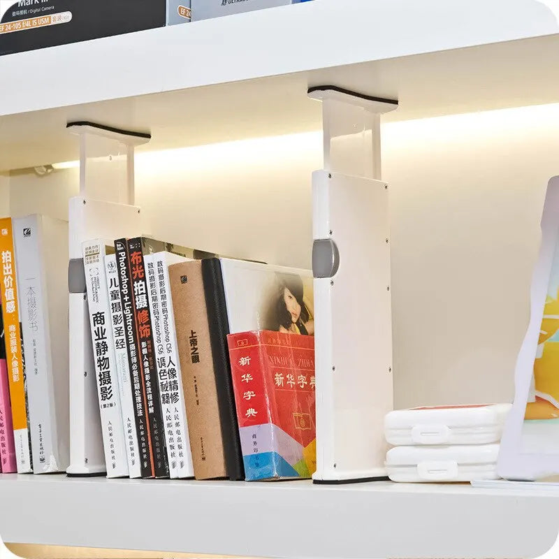Adjustable expandable drawer dividers separating items in a kitchen drawer