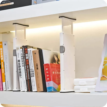 Adjustable expandable drawer dividers separating items in a kitchen drawer